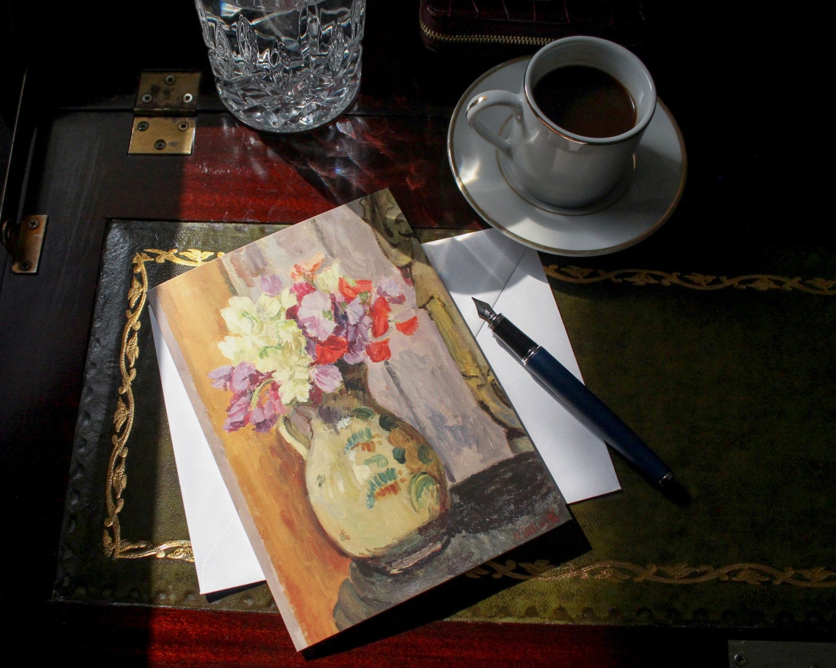 Sweet peas in jug with Indian Bhodisattva by Vanessa Bell